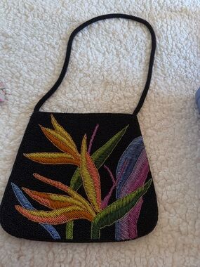 Black Beaded Crossbody Bag with Tropical Embroidered Motif. Sold at Chico’s